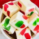 Small bowl of Nougat with green and red gumdrops inside.