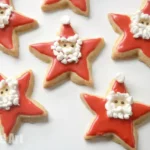 Star shaped cookies decorated as santa.
