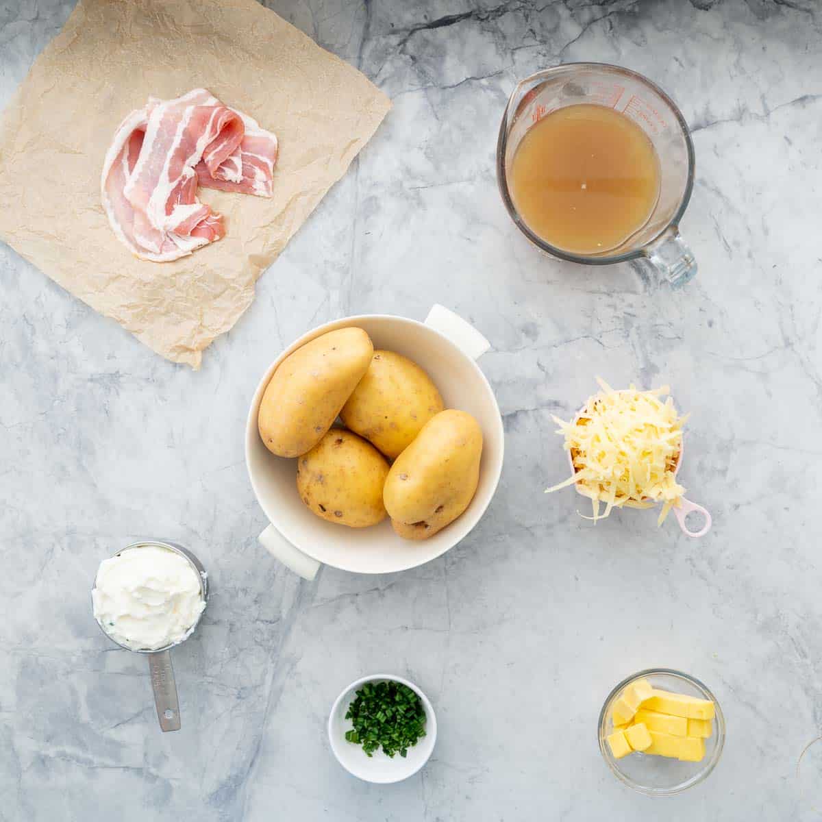 All the ingredients to make the baked mash potatoes laid out on the bench