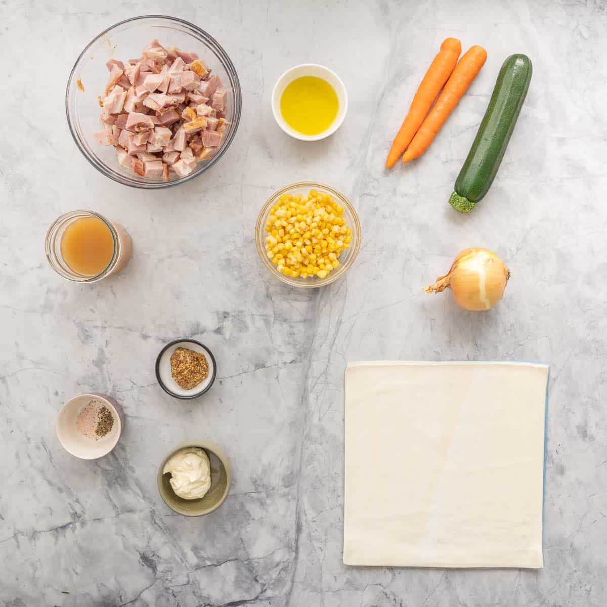 All the ingredients to make the Ham Pot Pie laid out on the bench