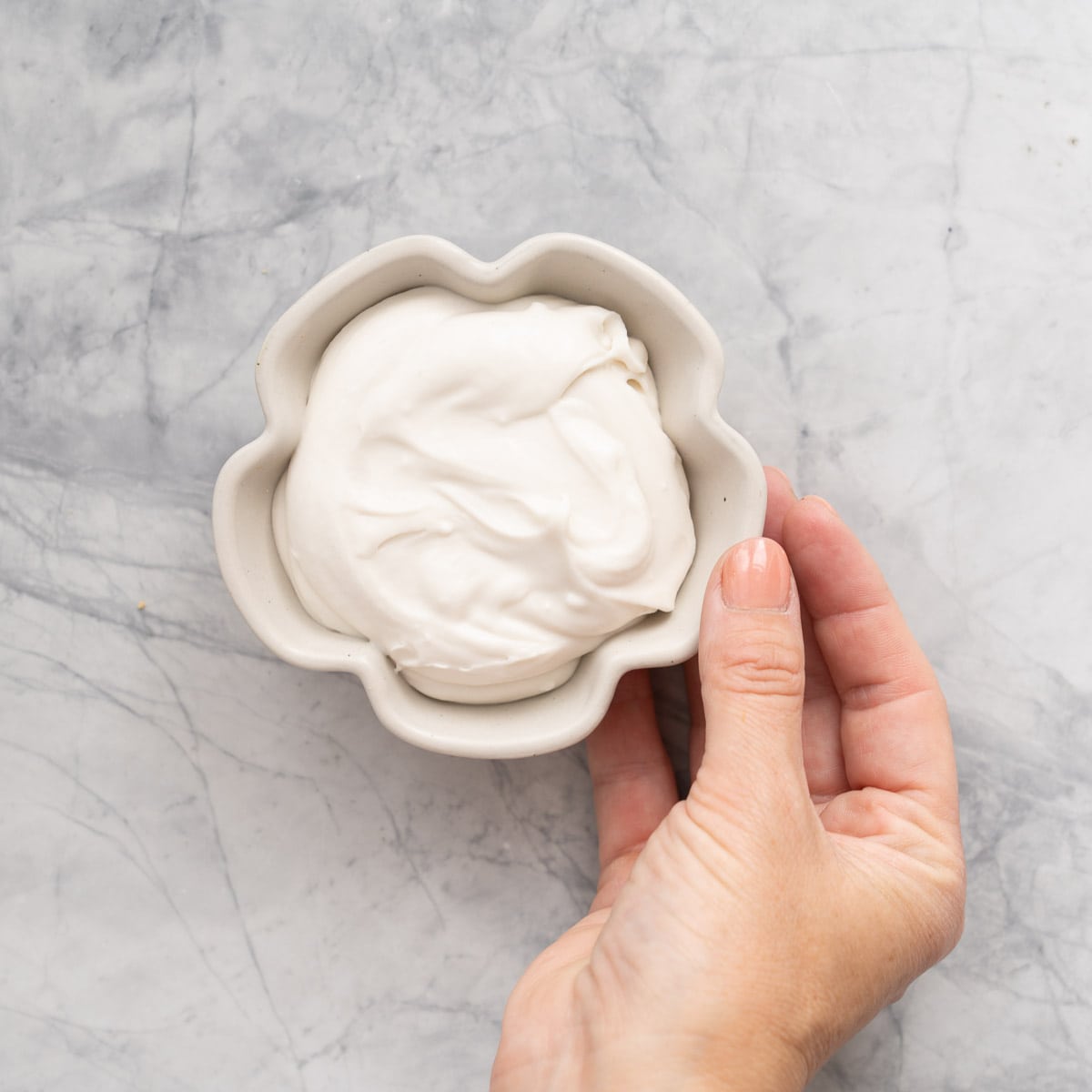 Coconut whip in a small flower shaped dish.