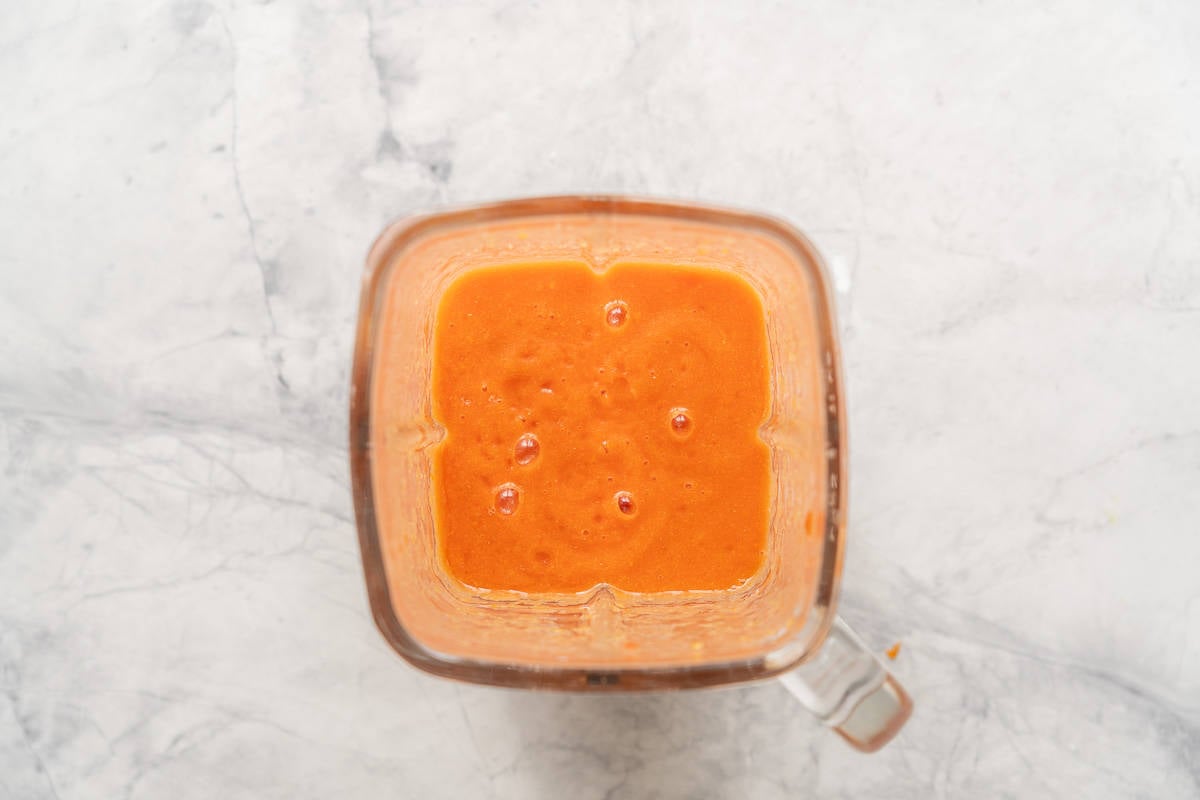 Dried apricots, water and tinned tomatoes whizzed together in a blender which is resting on the bench