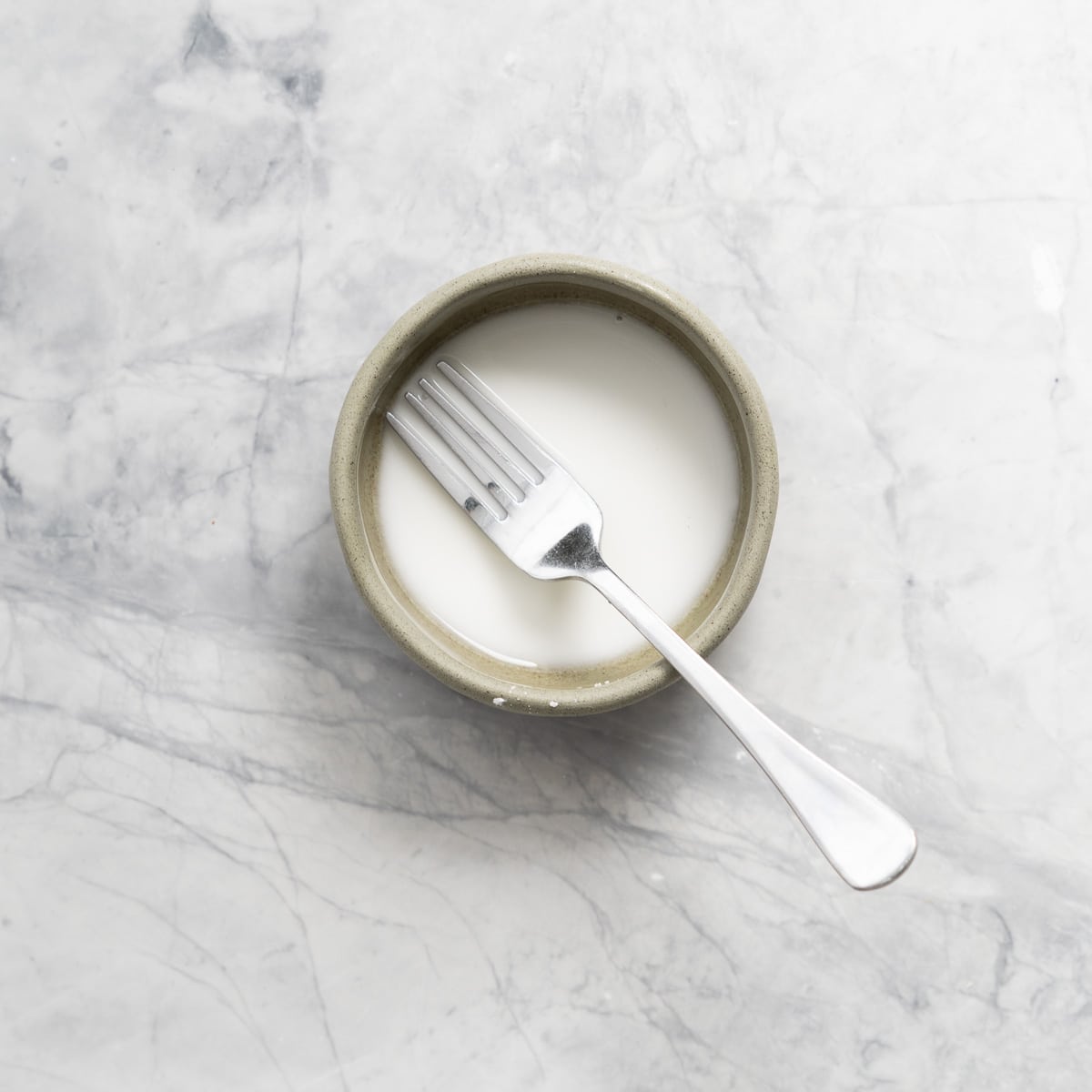 Combined cornflour and water in a small ramekin which is sitting on the bench