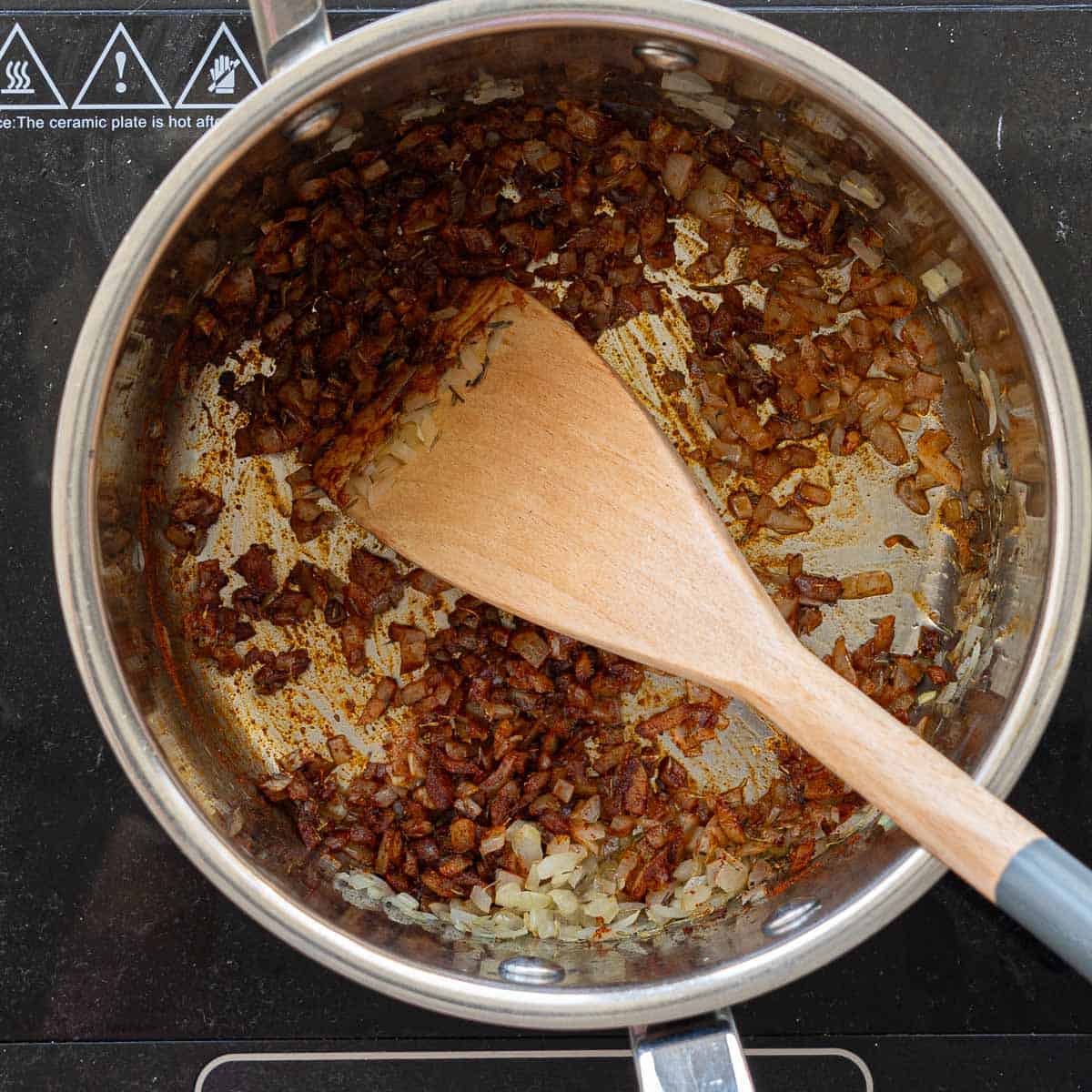 Sautéed finely diced onion and paprika in the bottom of a large saucepan.