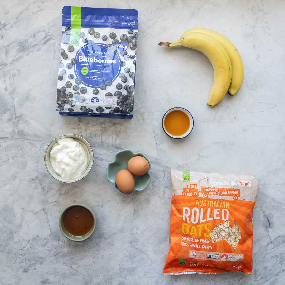 Ingredients for Blueberry oatmeal muffins laid out on bench top.