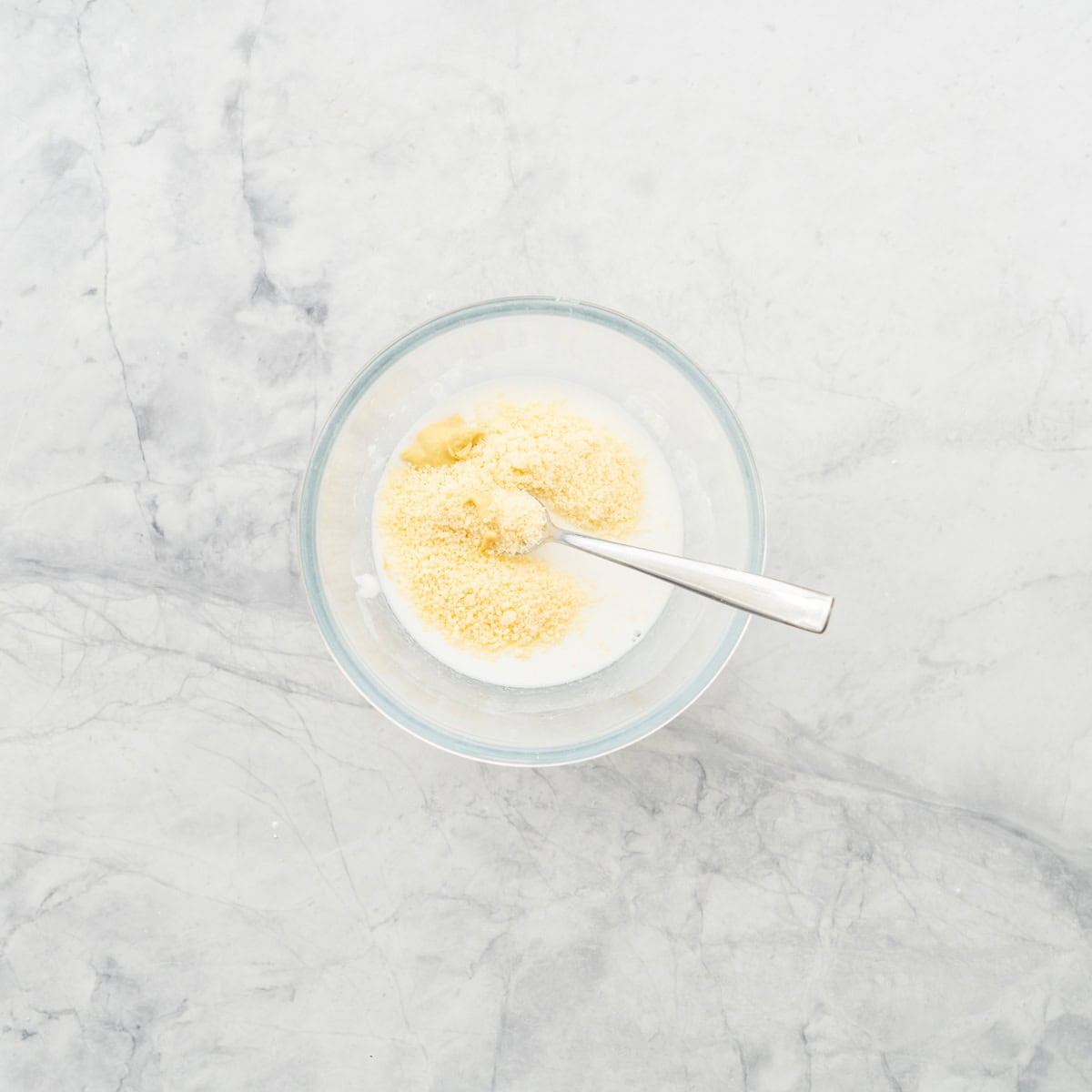 A cornflour slurry with parmesan cheese sprinkled on top.