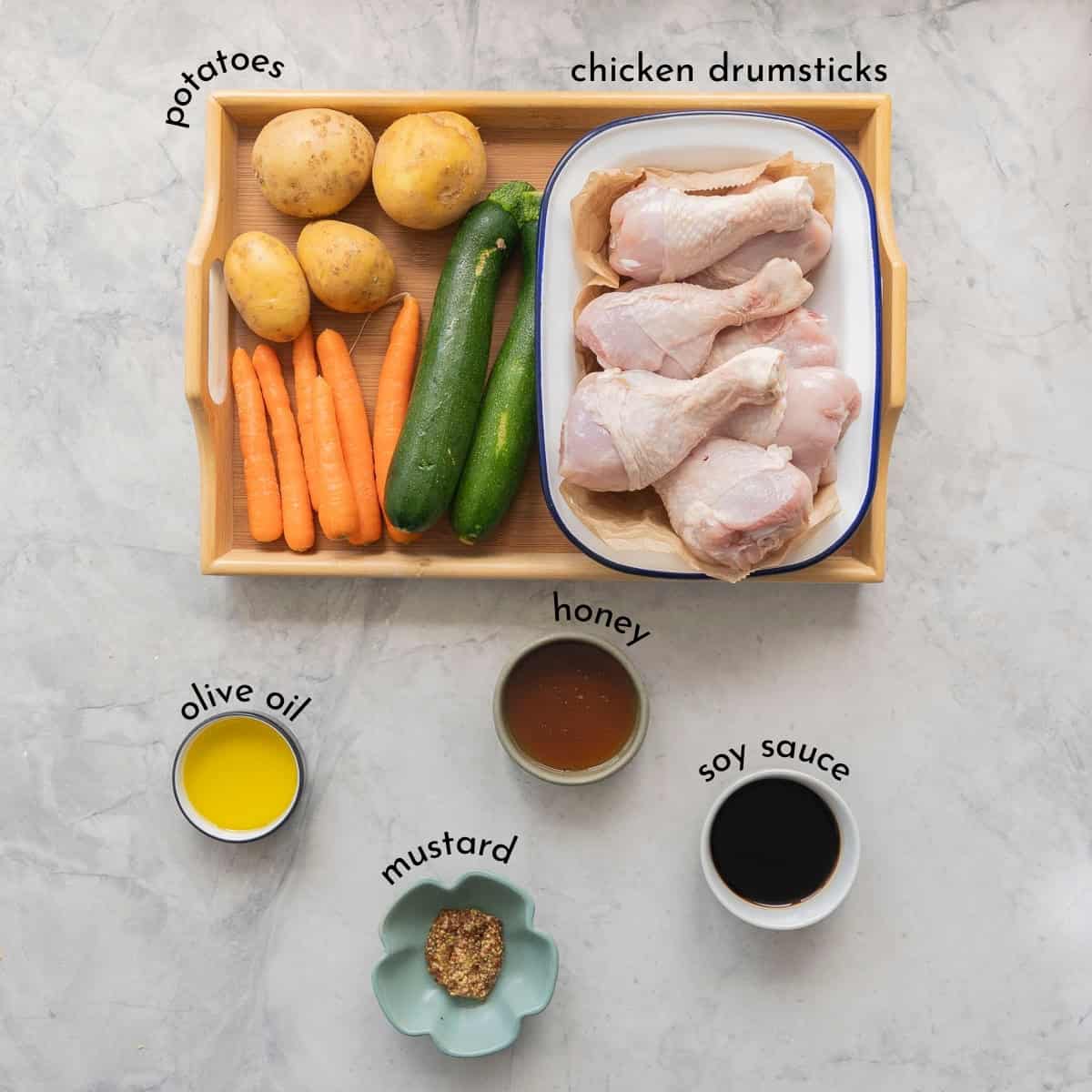 Ingredients for Honey soy chicken bake on a bench top with text overlay.