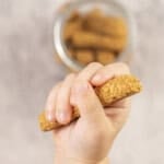 Toddler hand holiday a baby rusk.