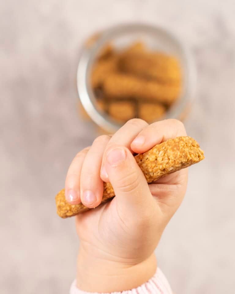 Toddler hand holiday a baby rusk.