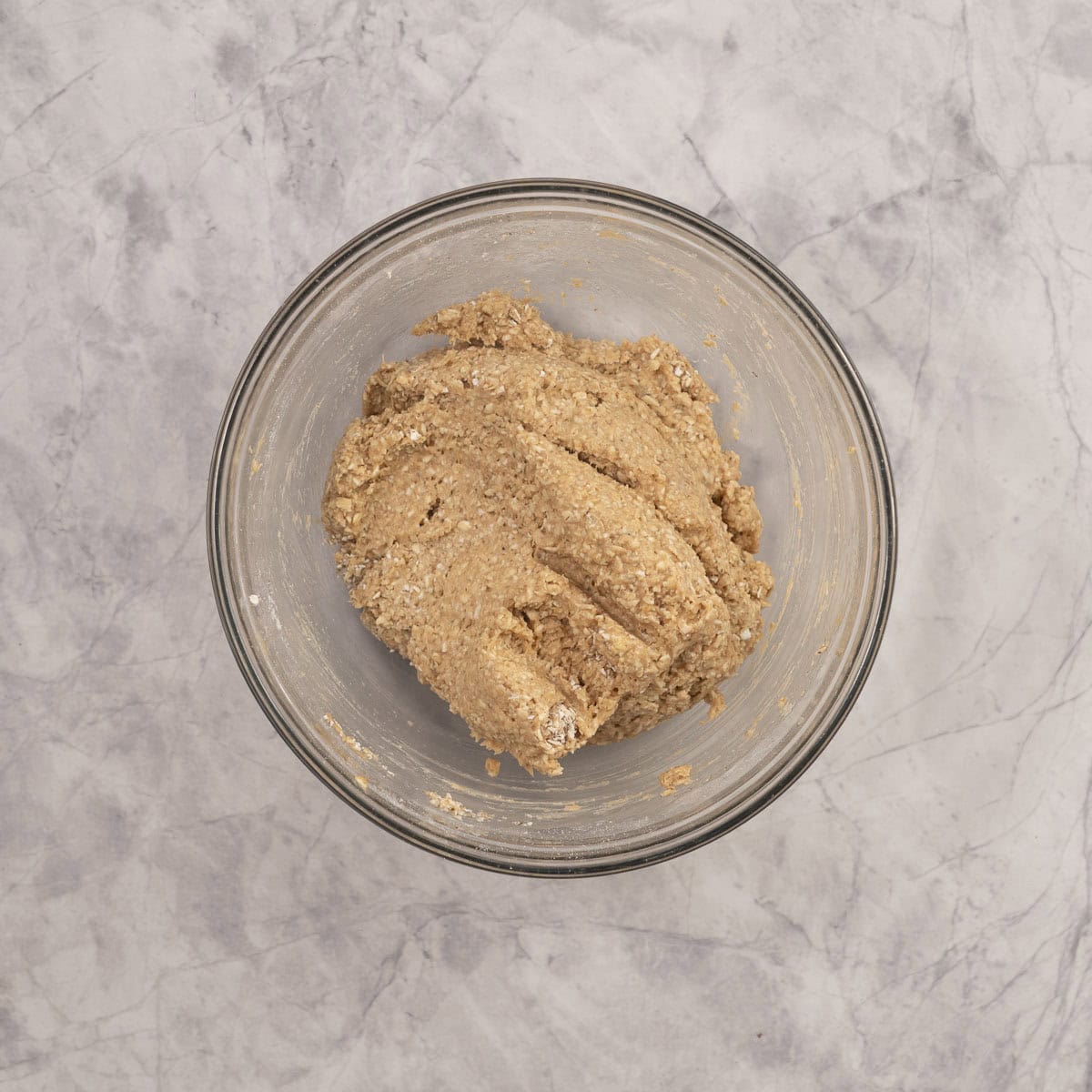 Baby rusk mixture in a large glass bowl on benchtop.