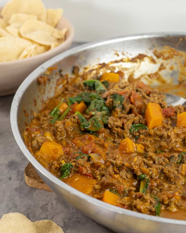 Pan of mince curry on benchtop.
