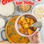 Hand holding toddler silicone plate with baby fork, rice and chicken curry inside with text overlay; 'Chicken curry for kids, mild creamy and full of veggies!"