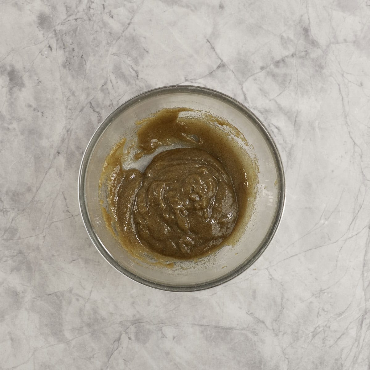 Brown sugar mixture combined in a glass bowl.